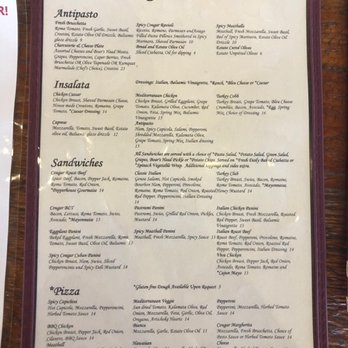Sangio's Deli - Menu 3/25/2022 - A menu board from Sangio's Deli in Temecula, CA, lists various food categories including Antipasto, Insalata, Sandwiches, Pizza, and Dolce. Each section provides detailed descriptions of dishes such as Spicy Cougar Ravioli, Chicken Caesar, Classic Italian, and Spicy Capicci, with ingredients and preparation notes. The menu also notes gluten-free options and additional details about ingredients and preparation methods. - Delis Near Me - Temecula, California