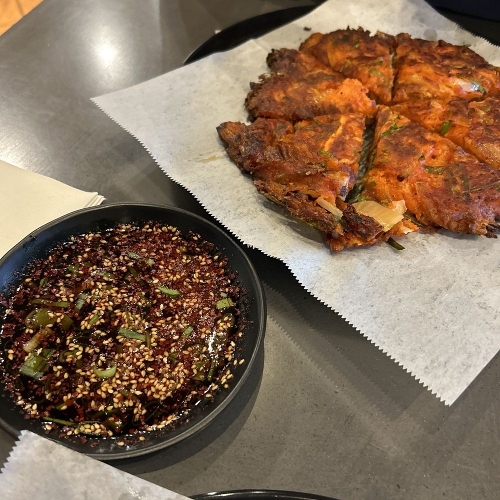 Cafe Moon - Kimchi Jeon $17.00 Korean savory pancake. Freshly made batter with house-made kimchi. This is what I come to this place for. - Korean Near Me - Kihei, Hawaii Cafe Moon - Kimchi Jeon $17.00 Korean savory pancake. Freshly made batter with house-made kimchi. This is what I come to this place for. - Korean Near Me - Kihei, Hawaii