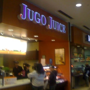 Jugo Juice - a group of people at a counter - Juice Bars & Smoothies Near Me - Edmonton, Alberta