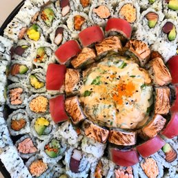 a plate of sushi and vegetables a plate of sushi and vegetables