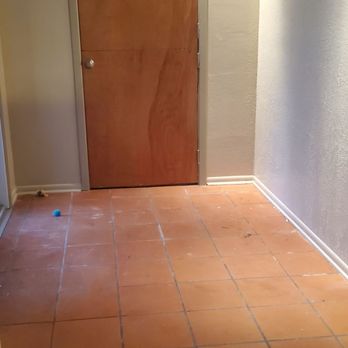 Stephanie's Construction - Family room and entrance way tile. Update of family room fireplace. Wall color change. - General Contractors Near Me