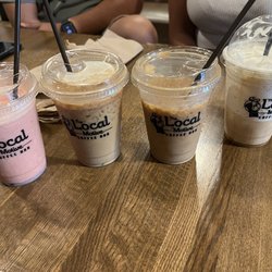 The Local Motive Coffee Bar - Left to right: strawberry smoothie, 2 iced caramel macchiatos with oat milk, caramel frappe
