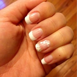Nail Spa - For my wedding nails I wanted the ring finger to be a little fancier. So classic white French too with a lace design.