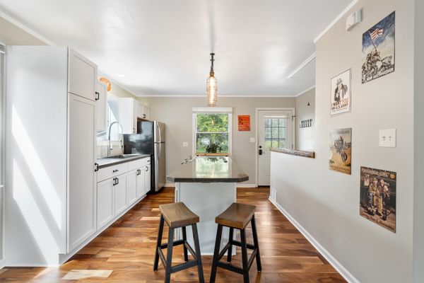 Single Family Remodel - The client had a 900 SF single family foreclosure and wanted a complete overhaul. The project included removing/relocating several walls, gutting the kitchen and bathroom, new flooring and trim throughout, fresh paint, and updated fixtures.