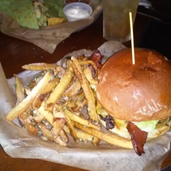 Bronx Alehouse - Parmesan fries and bacon cheddar burger. In the back cheese quesadilla with sour cream, chips, and salsa. - American Near Me - Bronx, New York