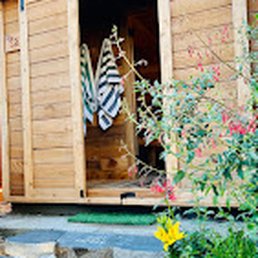 Exterior outside entrance of Uptown Sauna House - Our Finnish inspired sauna is electric heated. It has space to store towels and small items. It's heated between 189-205 degrees. - Vancouver, Washington Exterior outside entrance of Uptown Sauna House - Our Finnish inspired sauna is electric heated. It has space to store towels and small items. It's heated between 189-205 degrees. - Vancouver, Washington