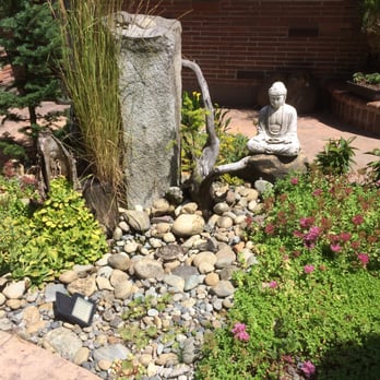 VanTran Gardening - a buddha statue in a garden - Landscaping Near Me - University Place, Washington VanTran Gardening - a buddha statue in a garden - Landscaping Near Me - University Place, Washington
