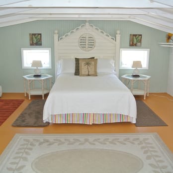 The Rush Inn - "The Alice" a cottage at the Rush Inn a view of the bedroom. - Hotels Near Me - Bradenton Beach, Florida The Rush Inn - "The Alice" a cottage at the Rush Inn a view of the bedroom. - Hotels Near Me - Bradenton Beach, Florida