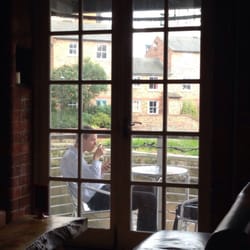 Stew & Oyster Bar - Relax above the river.