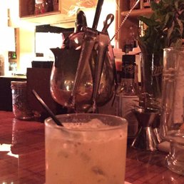 a cocktail in a glass on a bar