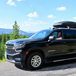 A to Z Chauffeurs - Suburban on the road with Lone Peak in the background