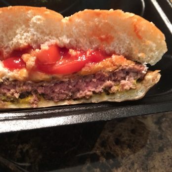 Fricker's - I ordered a well done burger and they gave me this. It was red and blood came out of it. If your pregnant cut it first so you don't get sick - Chicken Wings Near Me - DAYTON, Ohio