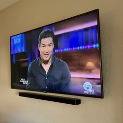 Hall Installations - Tv mounting on drywall with soundbar in Boca Raton, FL.