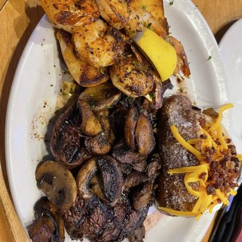 Texas Roadhouse - Ribeye with grilled shrimp and loaded baked potato! Phenomenal. - American Near Me - Gilbert, Arizona