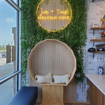 Jam + Toast - a seating area in front of a window - Breakfast & Brunch Near Me - Frisco, Texas