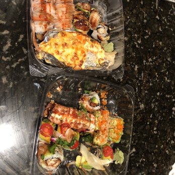 Mizu - two plastic containers with food in them - Sushi Bars Near Me - Raleigh, North Carolina