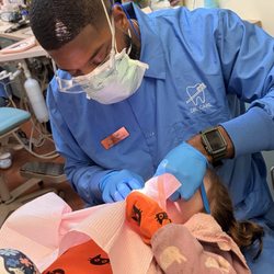 Uptown Pediatric Dentistry - Dr. Carl performing examination