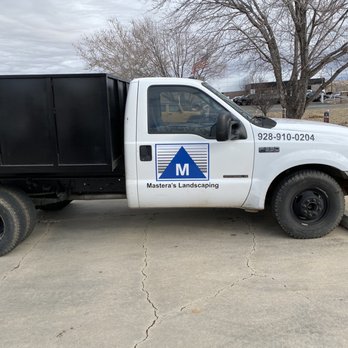 Mastera's Landscaping - a truck parked in a driveway - Landscaping Near Me Mastera's Landscaping - a truck parked in a driveway - Landscaping Near Me