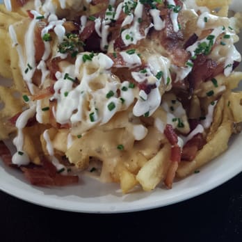Bruxie - Waffle fries loaded with melted cheddar, real bacon mini strips, sour cream and chive bits! Soooooo delicious! - Breakfast & Brunch Near Me - Brea, California