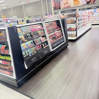 Target - Cosmetics - Display shelves with makeup products are arranged inside a Target store in Malvern, PA, with promotional posters of models and beauty products overhead. - Department Stores Near Me - Malvern, Pennsylvania