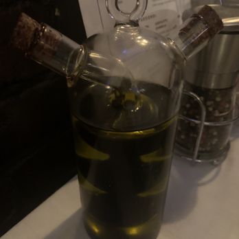 Luca Italian Restaurant - Cool olive oil/balsamic vinegar dispenser, but it's very dirty, caked in residue and sticky/greasy when you use it. - Italian Near Me - Everett, Washington