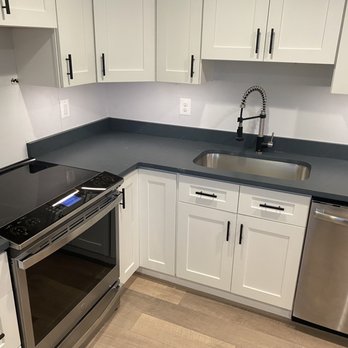 S & D Improvements - a clean kitchen with stainless steel appliances - Flooring Near Me S & D Improvements - a clean kitchen with stainless steel appliances - Flooring Near Me