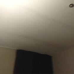 Victoria Inn - 1st impression of room. Very stained ceiling.