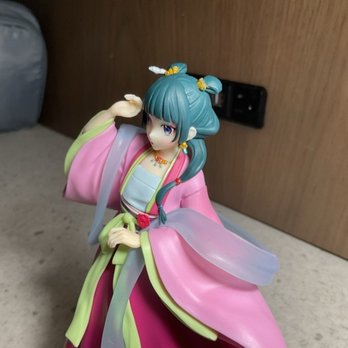 Hi Hi Mochi - green haired girl anime figure, blue eyes, wavy pink and green outfit. - Toy Stores Near Me - Sacramento, California