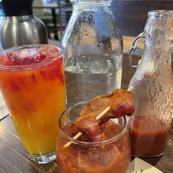 First Watch - Morning Sunrise of OJ, turmeric and agave syrup. The BEST Bloody Mary with millionaire bacon! Bailee was very attentive - Breakfast & Brunch Near Me - Pearland, Texas