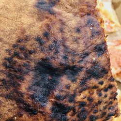 The back of my son's burnt pizza.