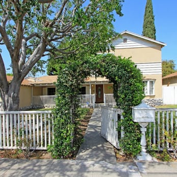 Supreme Tree Experts - Not the best shot of the Ficus but you can get the idea! And there's three cypress on the right also shaped and trimmed. - Tree Services Near Me - Santa Ana, California