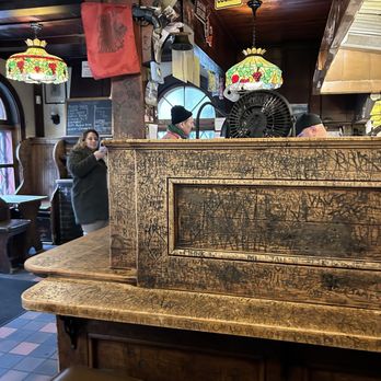 Louis' Lunch - Carved counter seating - Burgers Near Me - New Haven, Connecticut Louis' Lunch - Carved counter seating - Burgers Near Me - New Haven, Connecticut