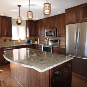 Earth Tone Kitchen Remodeled With Walnut Cabinetry Granite