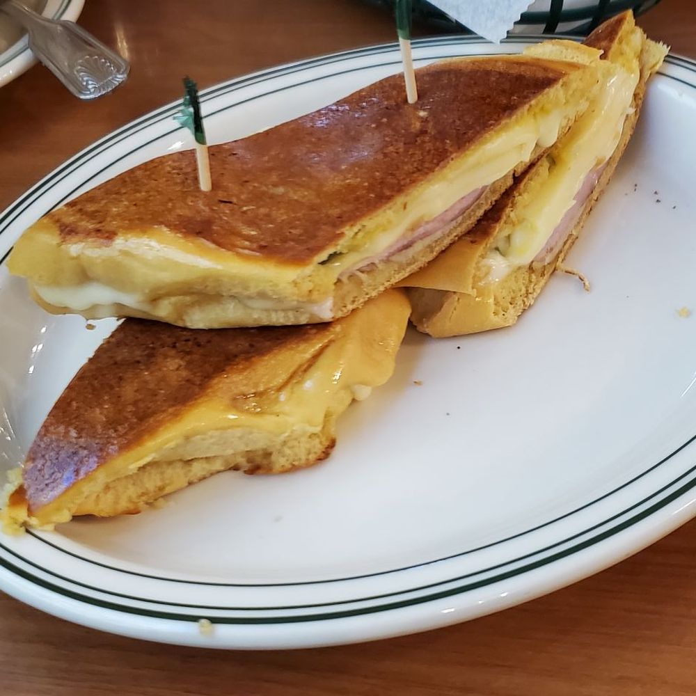 La Carreta - Media Noche sandwich (Sweet Cuban roll, ham, roast pork, Swiss cheese, mustard, and pickles) - Cuban Near Me - Miami, Florida La Carreta - Media Noche sandwich (Sweet Cuban roll, ham, roast pork, Swiss cheese, mustard, and pickles) - Cuban Near Me - Miami, Florida