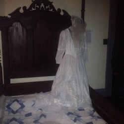 Farnam Manor Museum - This was uncanny! Mirrored image, no mirrors!  And you had to wear hats!  Lets the spirits know your friendly!  That's the owners!
