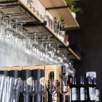 Floyd’s Wine Lounge - a row of wine glasses - Wine Bars Near Me - Brenham, Texas