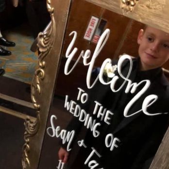 FAB Weddings - Our welcome sign by Ashley at Fab Weddings she did the calligraphy and this is her mirror decor and stand - Wedding Planning Near Me FAB Weddings - Our welcome sign by Ashley at Fab Weddings she did the calligraphy and this is her mirror decor and stand - Wedding Planning Near Me
