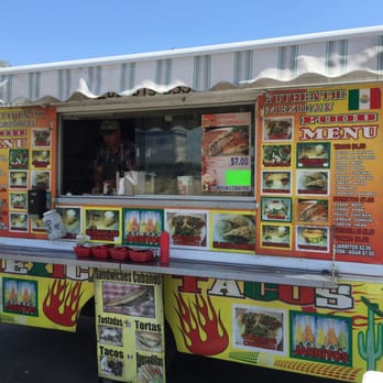Sandwiches El Cubano - The menu on the side of the truck! Amazing food gotta try it. - Cuban Near Me