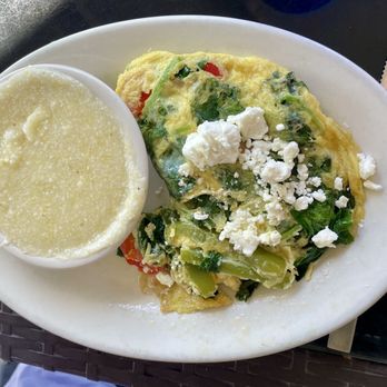 Sliders Seaside Grill - Spinach and goat cheese omelet with plain grits - Seafood Near Me - Fernandina Beach, Florida Sliders Seaside Grill - Spinach and goat cheese omelet with plain grits - Seafood Near Me - Fernandina Beach, Florida