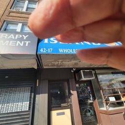 a hand holding a piece of paper a hand holding a piece of paper