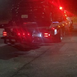 Alpine Towing - Car  being towed.