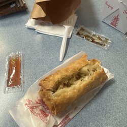 China King - Eggroll, one soy sauce, packet, and one sweet-and-sour sauce packet