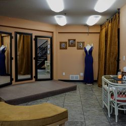 My Dress Store - Alterations platform; dressing room directly to the left of platform and mirrors.