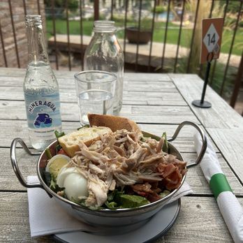 Camp Outpost - Chicken cobb salad with sparkling water (listed as Topo Chico). - New American Near Me - Springdale, Utah