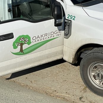 Oakridge Landscape - a white truck parked on the side of the road - Landscaping Near Me - Valenica, California