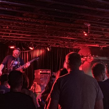 The Black Sheep - a man playing a guitar on stage - Music Venues Near Me - Colorado Springs, Colorado
