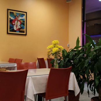 Trendy Thai - Near the front entrance of the interior with lots of freshly cutted yellow mums on each table - Thai Near Me - Irwindale, California Trendy Thai - Near the front entrance of the interior with lots of freshly cutted yellow mums on each table - Thai Near Me - Irwindale, California