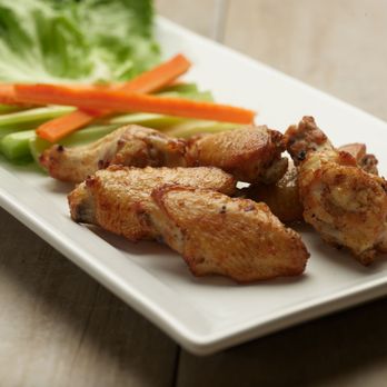 Pizza Twist - chicken wings and carrots on a plate - Pizza Near Me - Puyallup, Washington Pizza Twist - chicken wings and carrots on a plate - Pizza Near Me - Puyallup, Washington