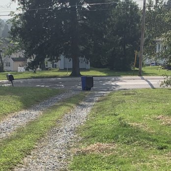 Waste Industries - Trash can in middle of driveway. - Recycling Center Near Me - Street, Maryland Waste Industries - Trash can in middle of driveway. - Recycling Center Near Me - Street, Maryland