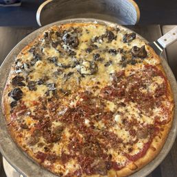 half wild mushroom and half chicago chop on thin crust half wild mushroom and half chicago chop on thin crust